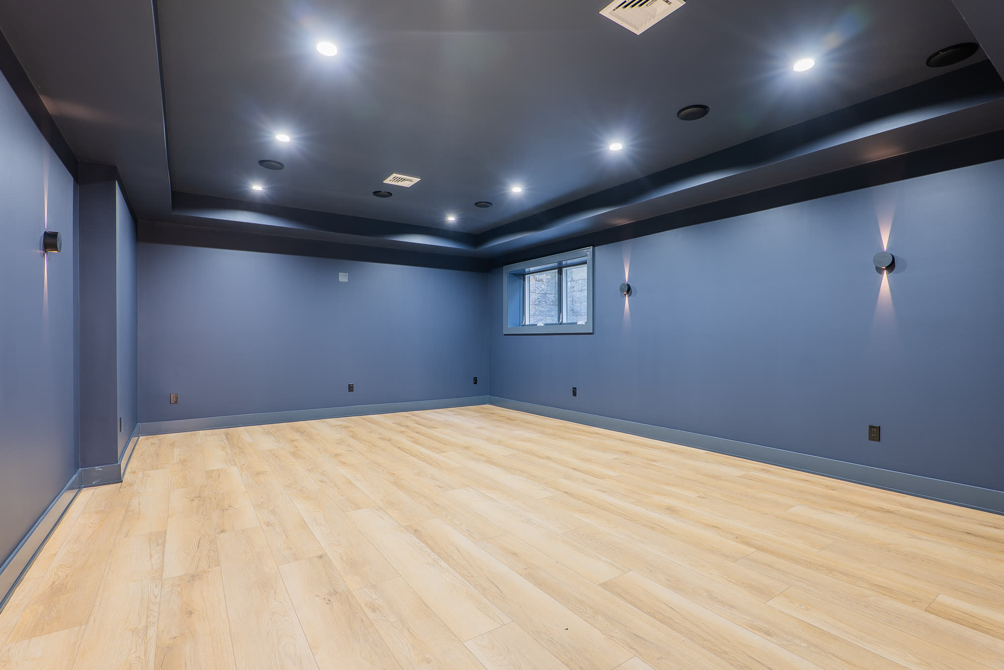 Lower level media room with recessed lighting