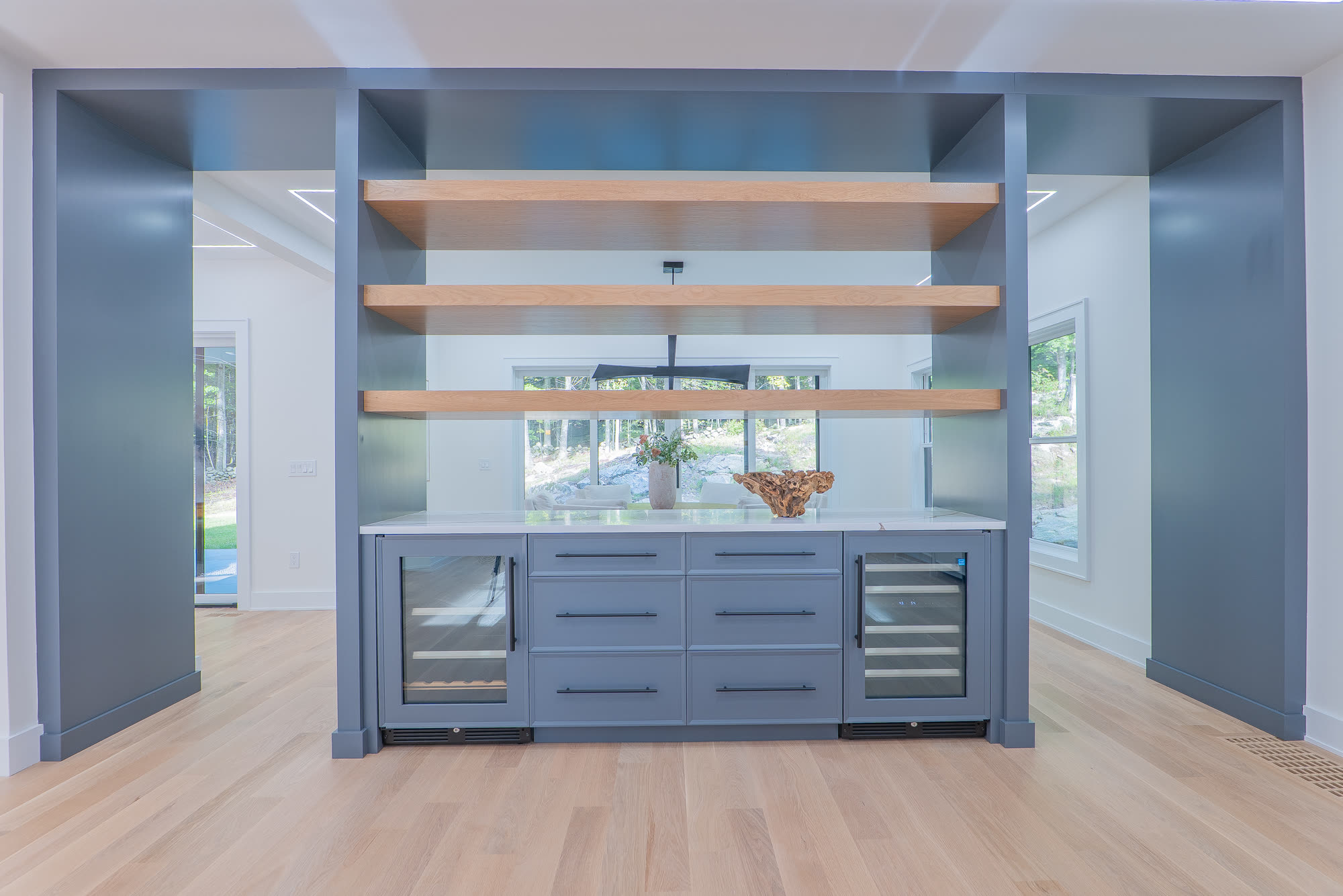 Butler pantry with open shelving and beverage coolers