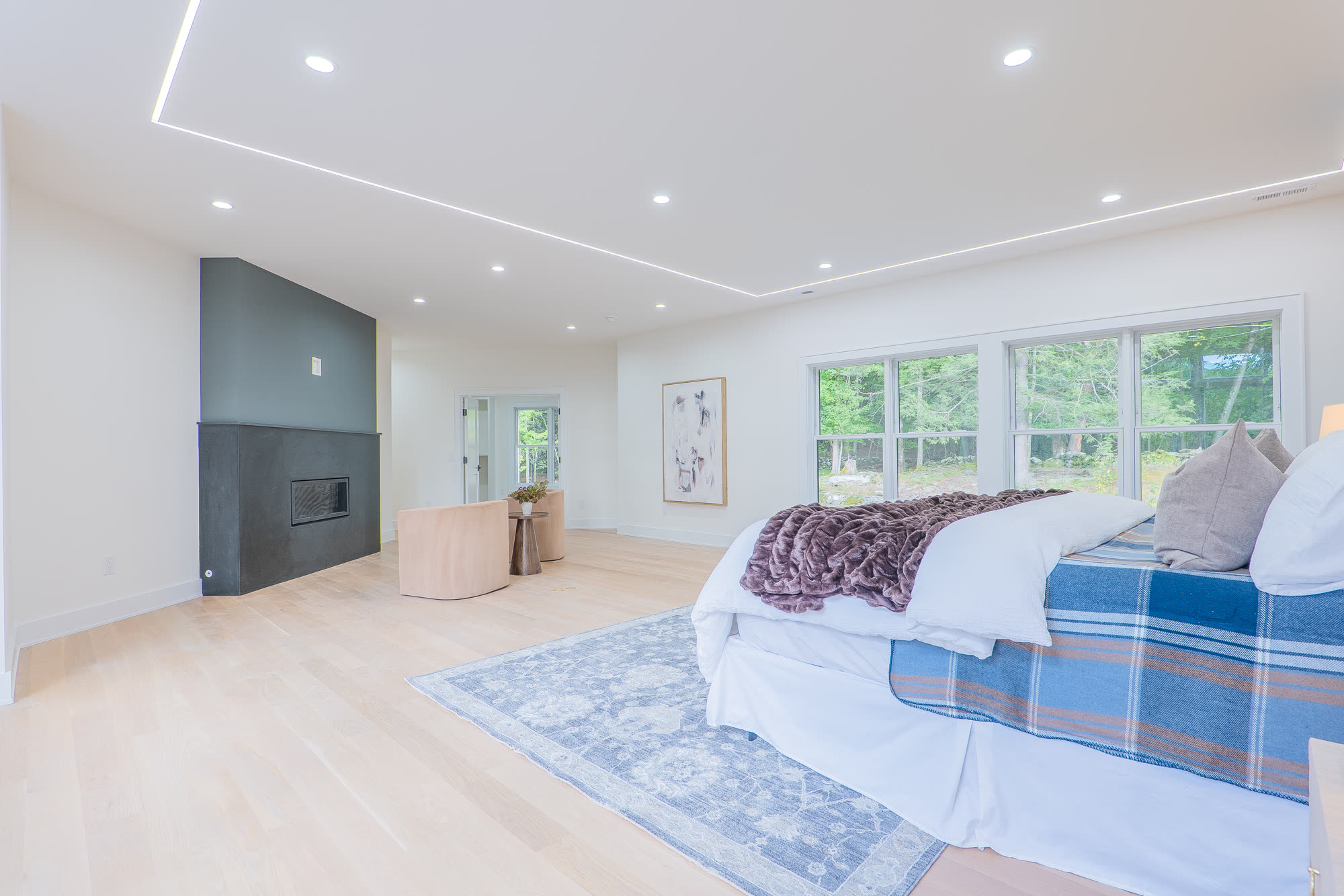 Primary bedroom fireplace and lounge corner