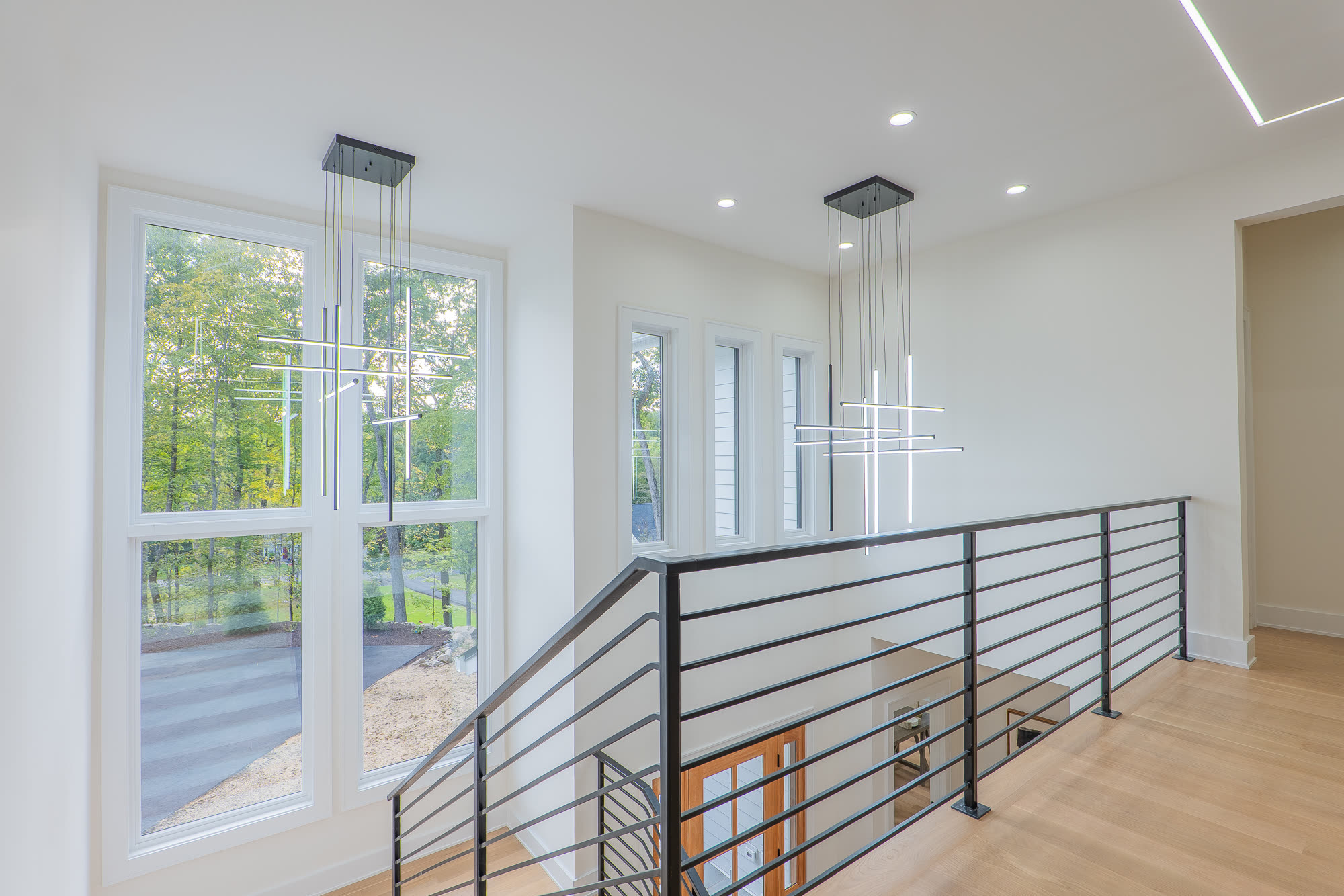 Upstairs landing with cascading pendant fixture