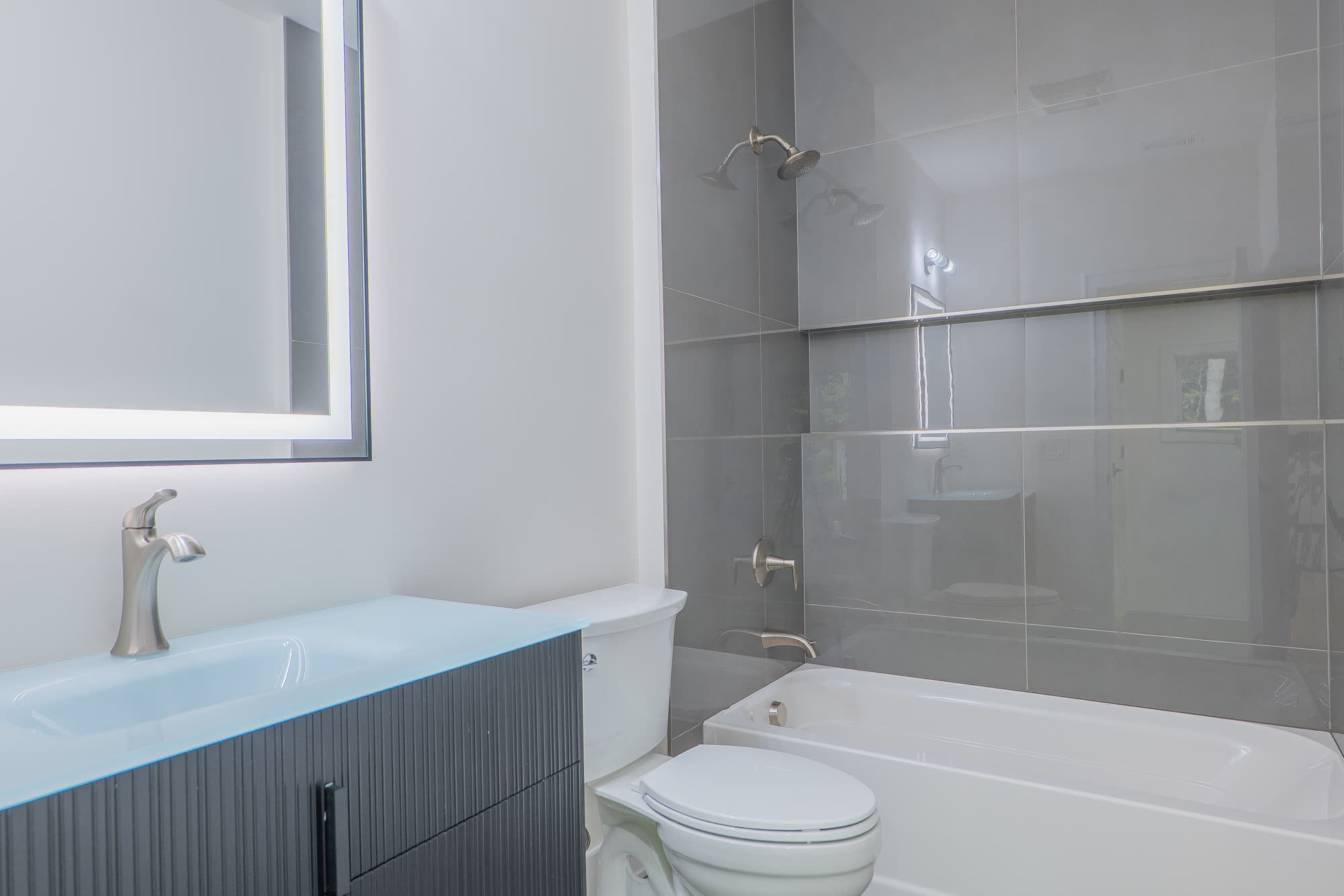 Bath with soaking tub and glass tile surround